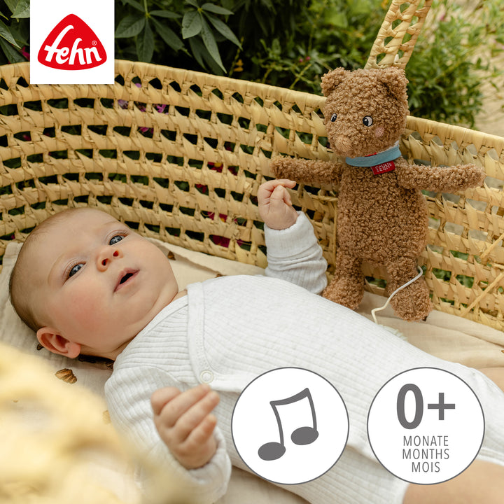 Baby Spieluhr Bär an Korb befestigt
