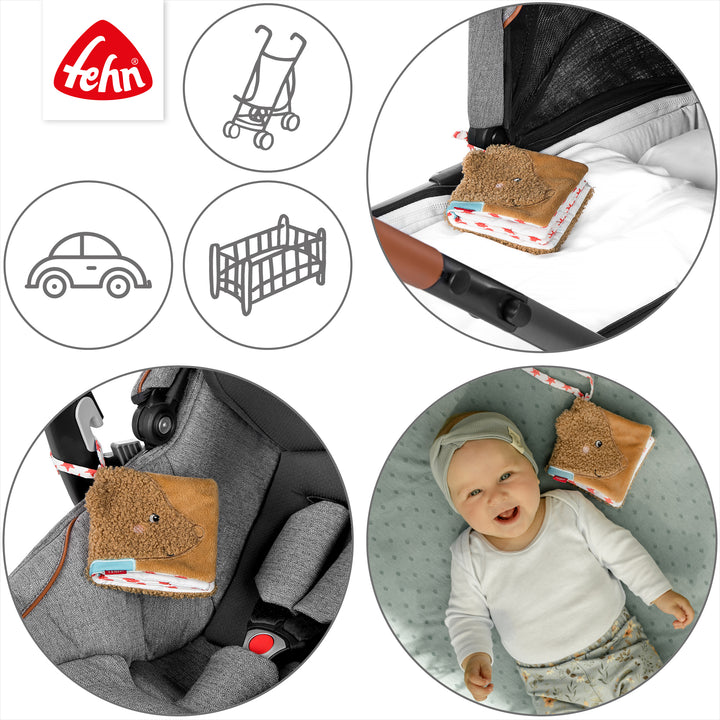 Baby Stoffbuch Bär an Kinderwagen und Babyschale befestigt