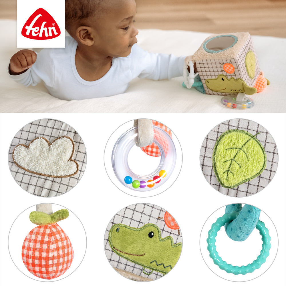 Detailansicht des Baby Activity-Würfels Capybara mit Spiegel, Greifring, Rassel, Quietsche, Raschelpapier und Glöckchen