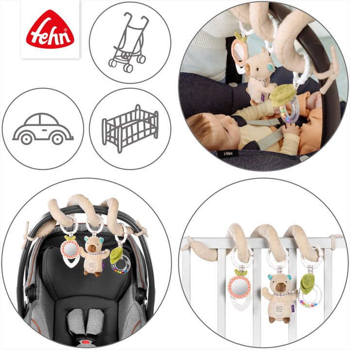 Baby Activity-Spirale Capybara an Babybett und Babyschale befestigt