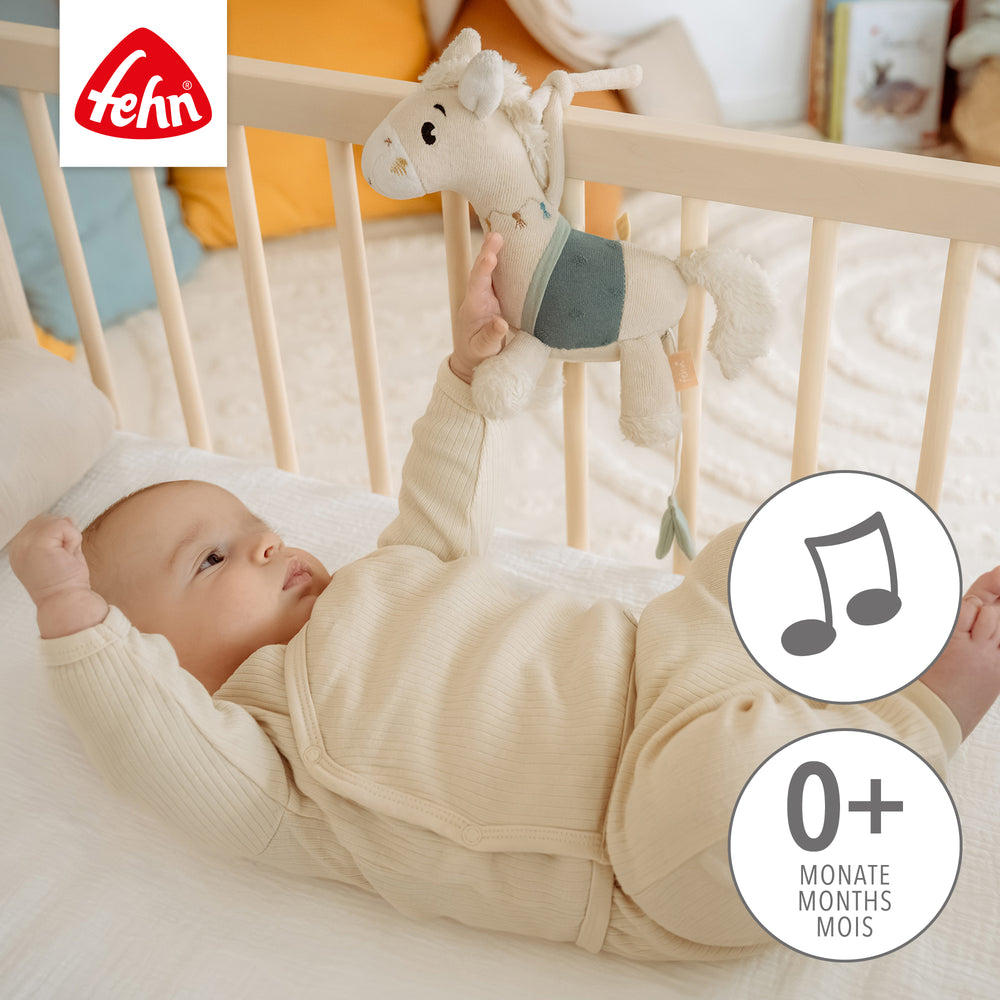 Baby Spieluhr Pferd an Babybett befestigt