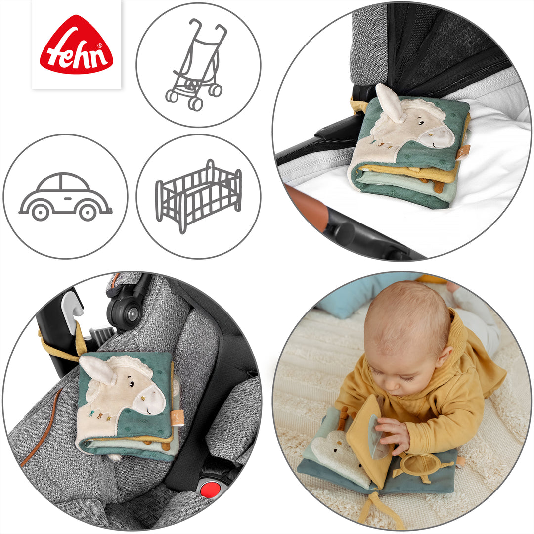 Baby Stoffbuch Pferd an Kinderwagen und Babyschale befestigt