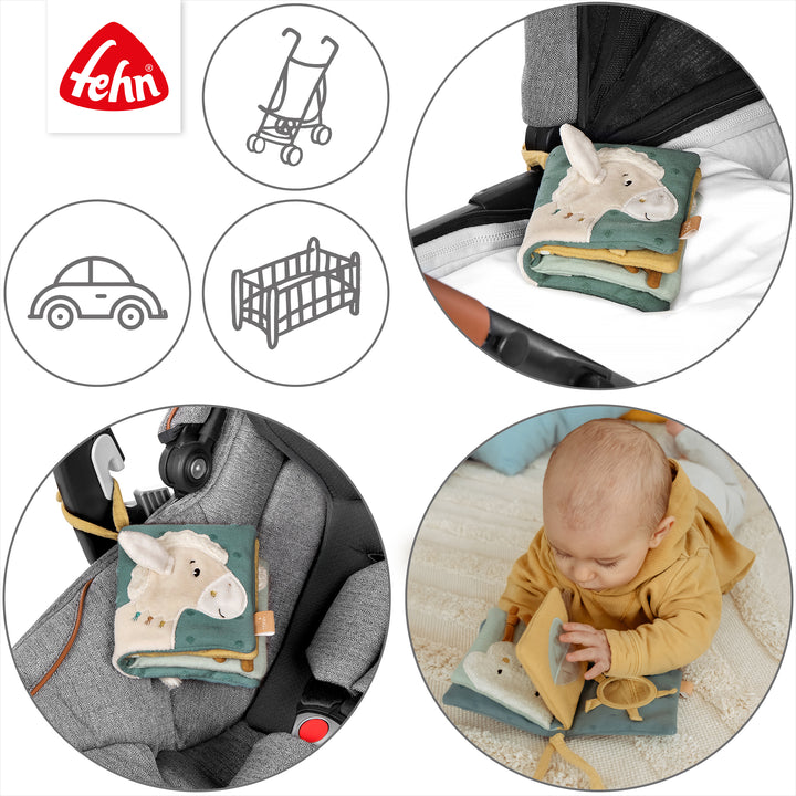 Baby Stoffbuch Pferd an Kinderwagen und Babyschale befestigt