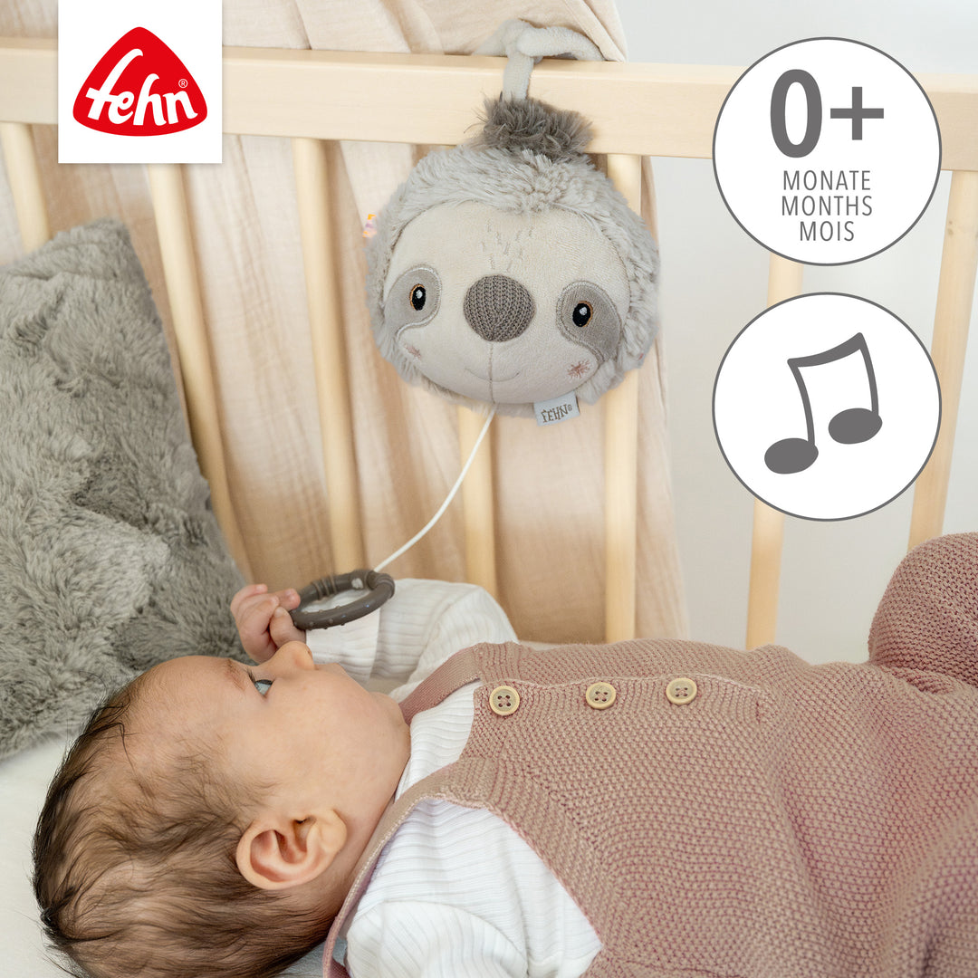 Baby Spieluhr Faultier am Babybett befestigt