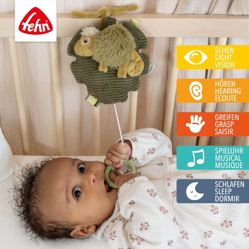 Baby Spieluhr Chamäleon am Babybett befestigt
