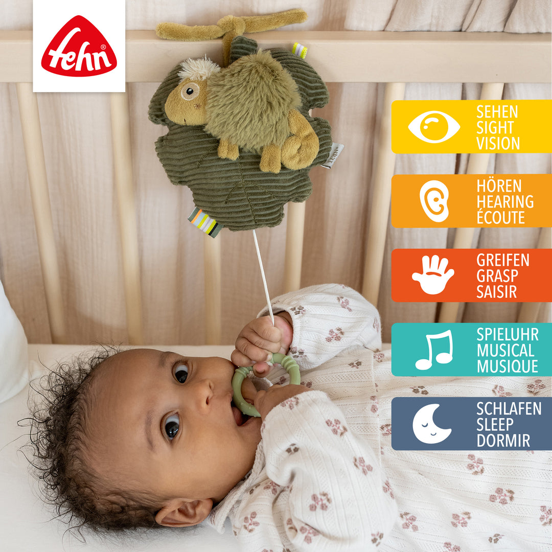 Baby Spieluhr Chamäleon am Babybett befestigt