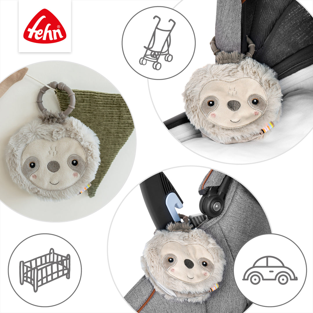 Baby Stoffbuch Faultier an Kinderwagen und Babyschale befestigt