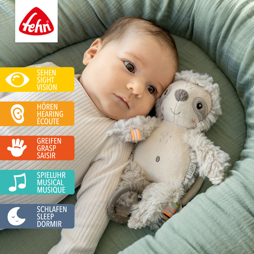 Baby liegt neben Baby Spieluhr Faultier