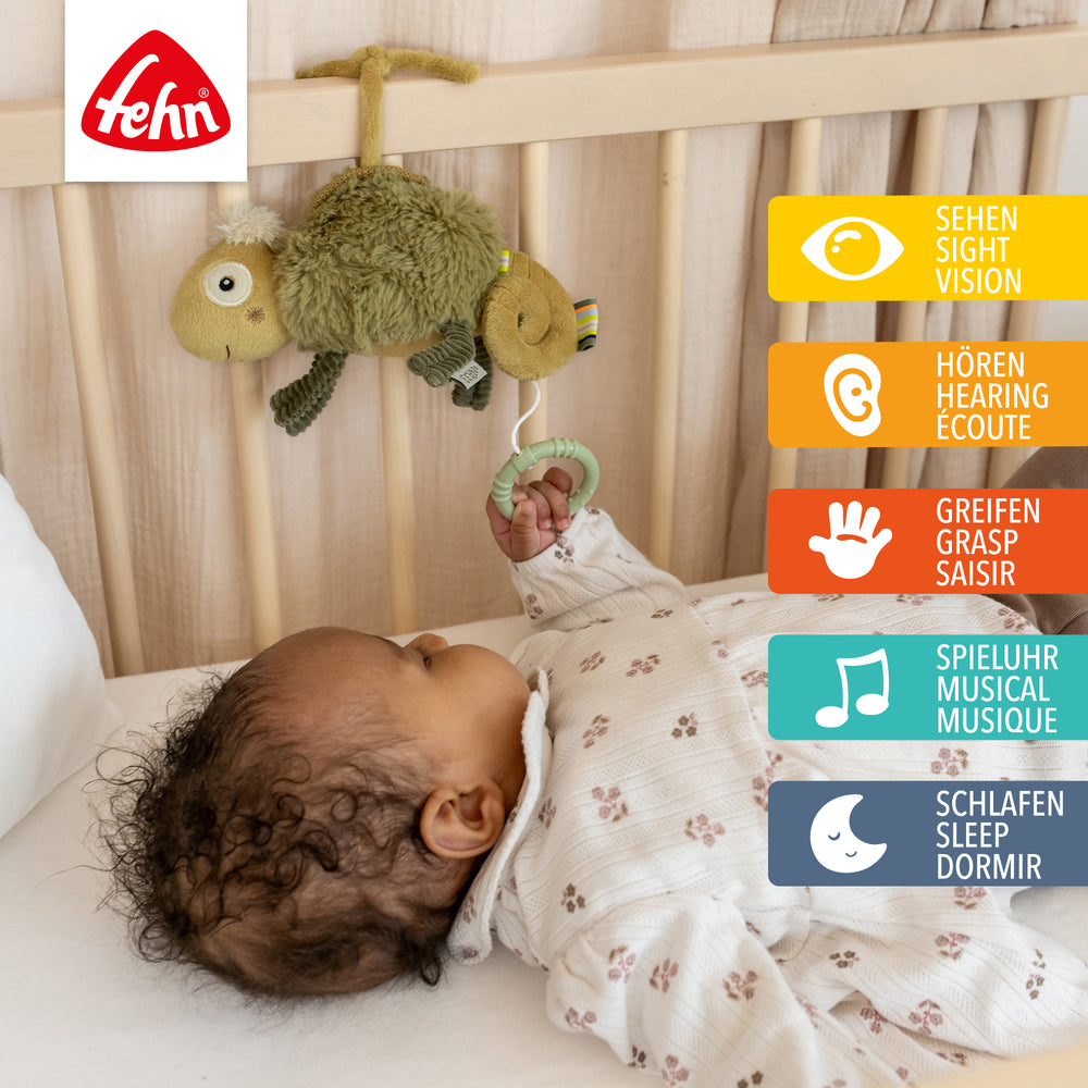 Baby Spieluhr Chamäleon am Babybett befestigt