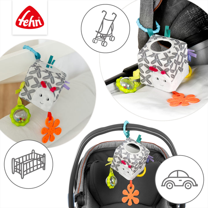 Baby Activity-Würfel Raupe an Babyschale und Kinderwagen befestigt