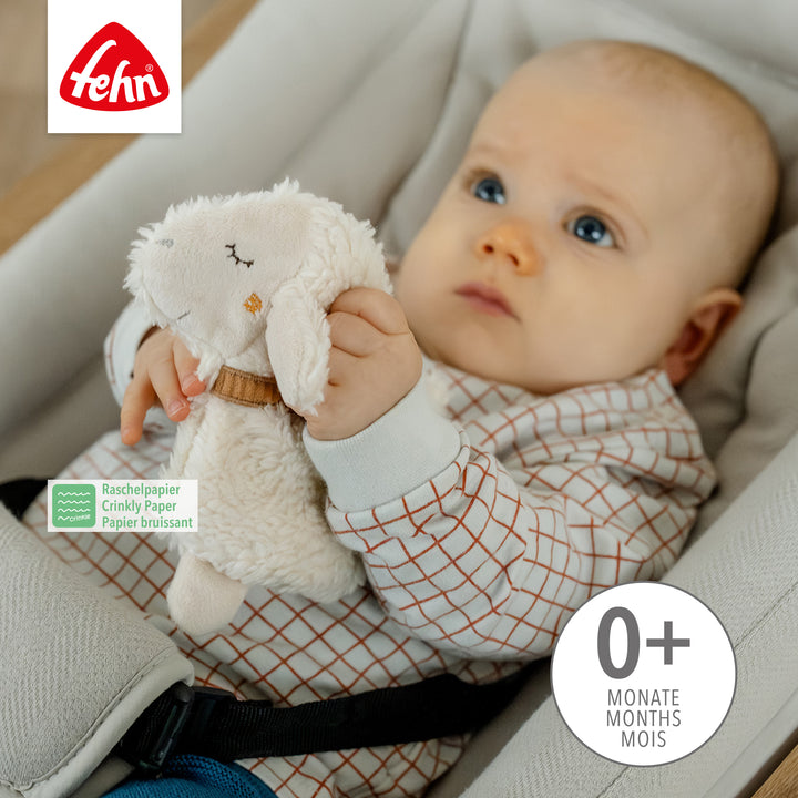 Baby spielt mit Baby Knister-Schaf