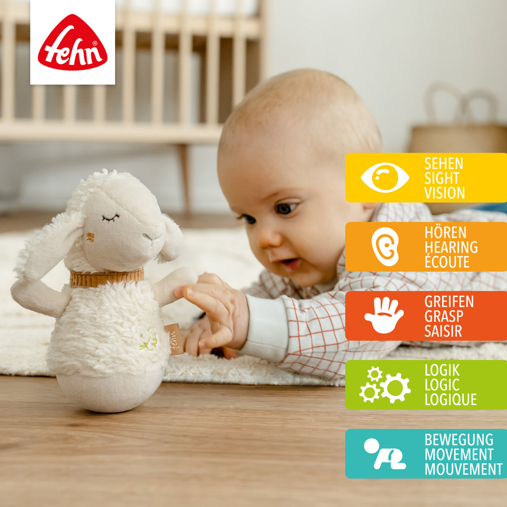 Baby stupst Baby Mini-Stehauf Schaf an