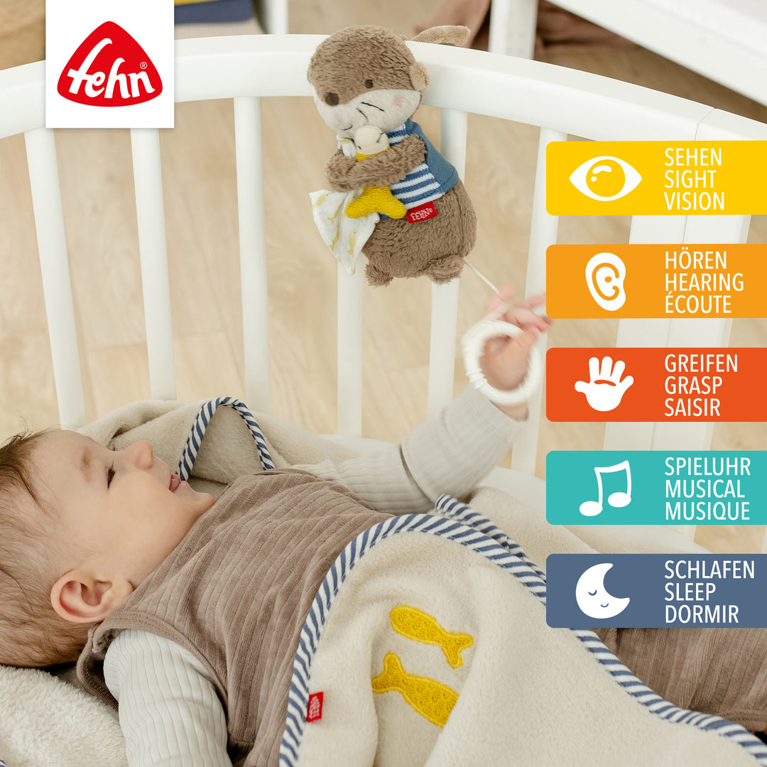 Baby Spieluhr Otter am Babybett befestigt
