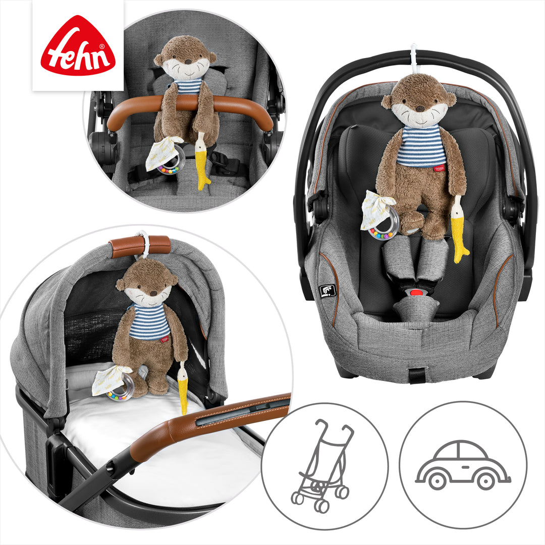 Baby Activity-Otter an Babyschale und Kinderwagen befestigt