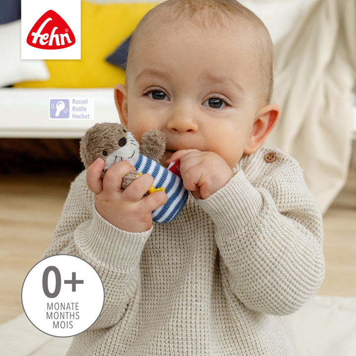 Baby spielt mit Baby Mini-Rassel Otter