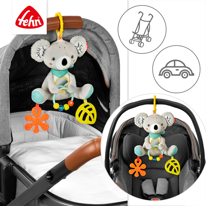 Baby Activity-Koala an Babyschale und Kinderwagen befestigt