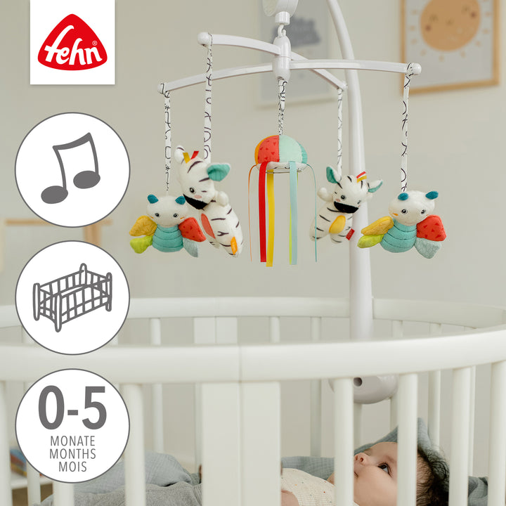 Baby liegt unter Baby Musik-Mobile DoBabyDoo