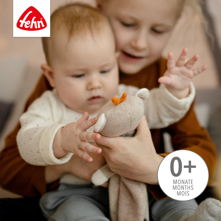 Baby spielt mit  Baby Schmusetuch Teddy