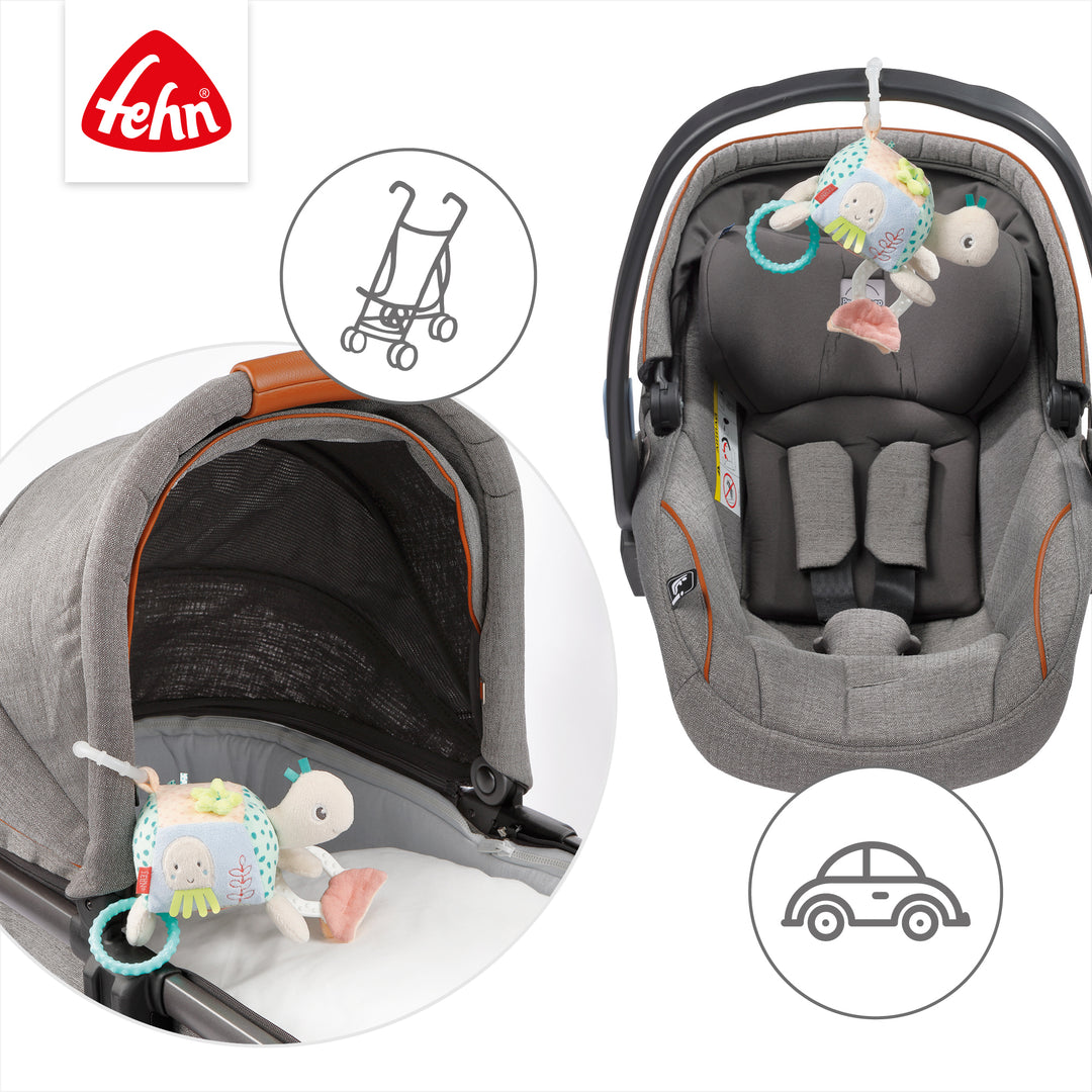 Baby Activity-Schildkröte an Babyschale und Kinderwagen befestigt