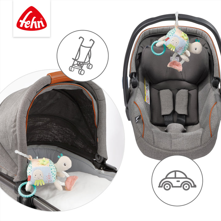 Baby Activity-Schildkröte an Babyschale und Kinderwagen befestigt
