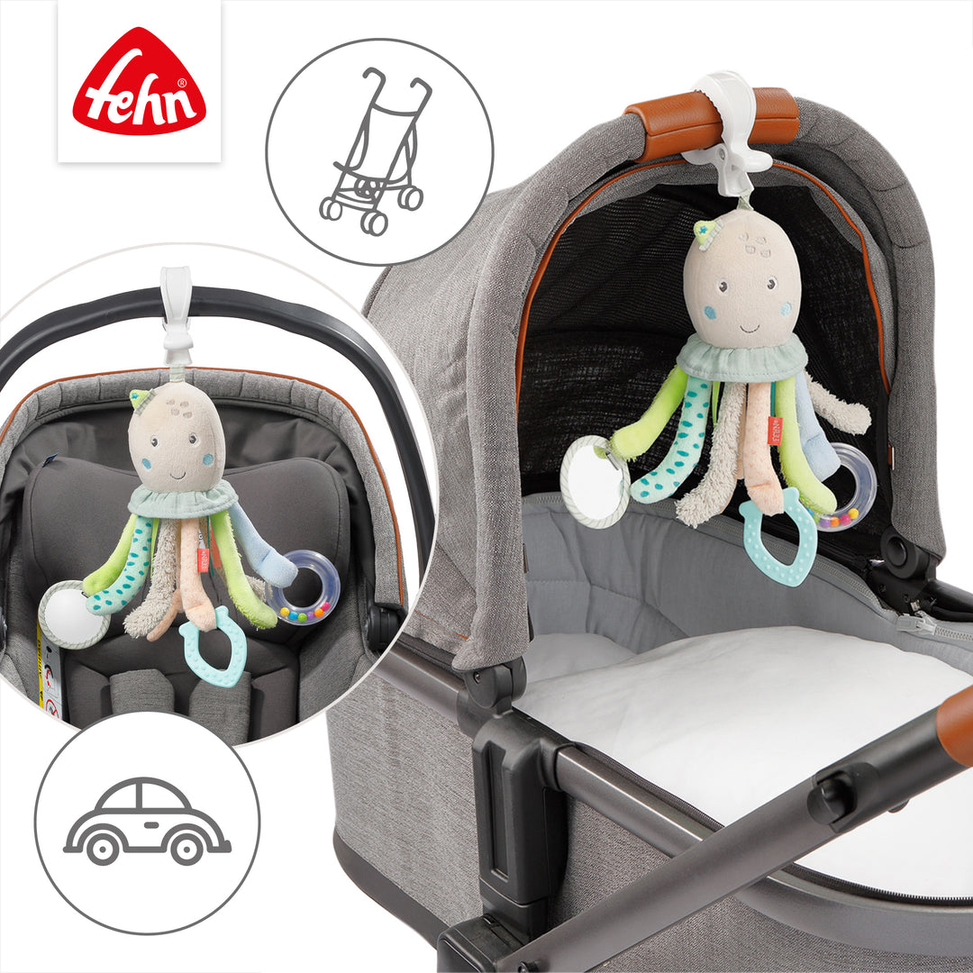 Baby Activity-Oktopus an Babyschale und Kinderwagen befestigt