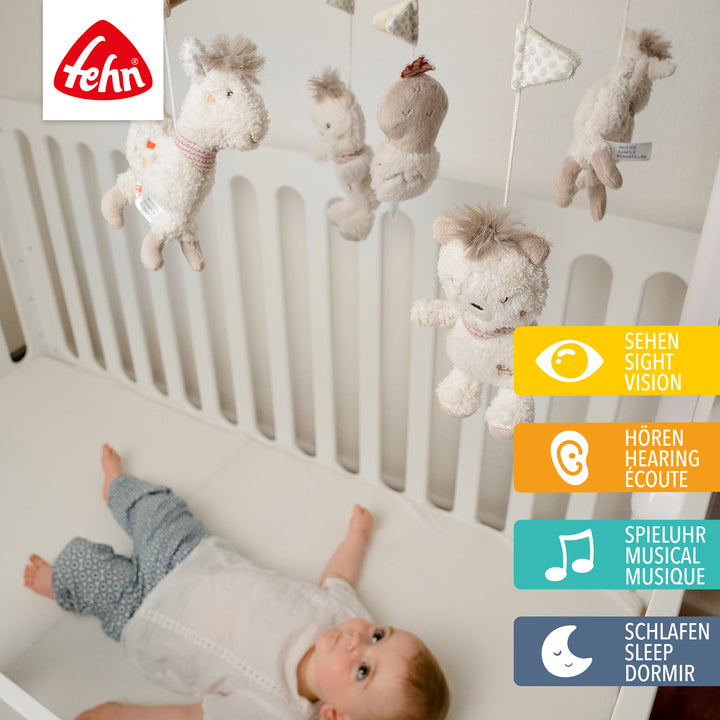 Baby liegt unter Baby Musik-Mobile Peru