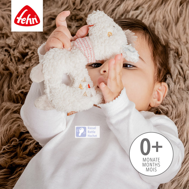 Baby spielt mit Baby Ring-Greifling Lama