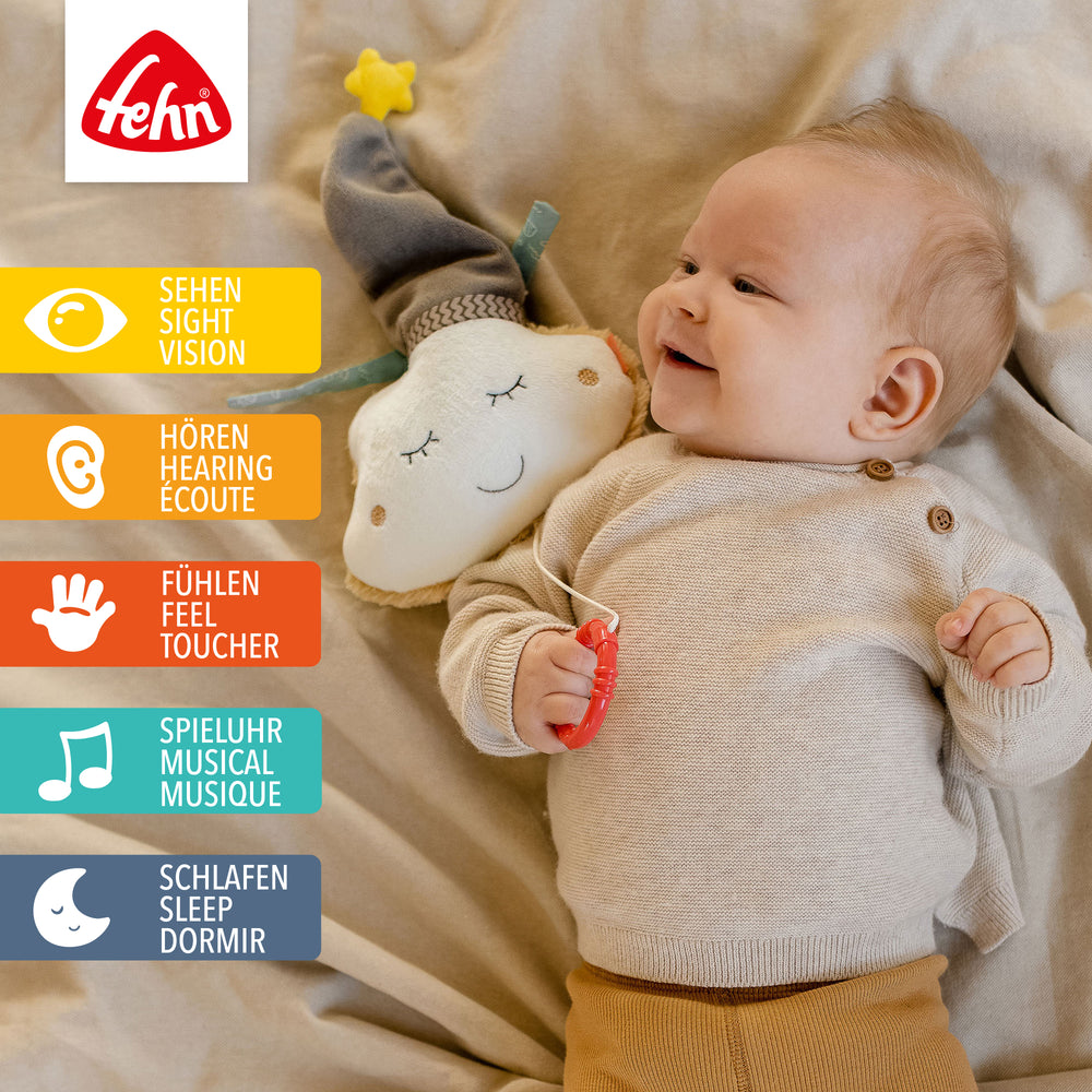 Baby spielt mit Baby Spieluhr Wolke