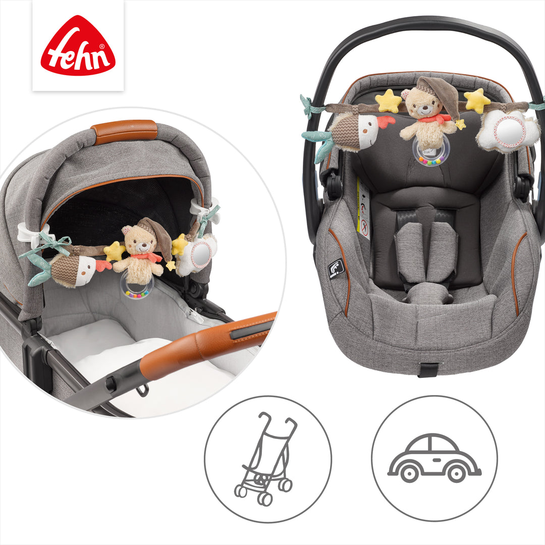Baby Kinderwagenkette Bruno an Babyschale und Kinderwagen befestigt
