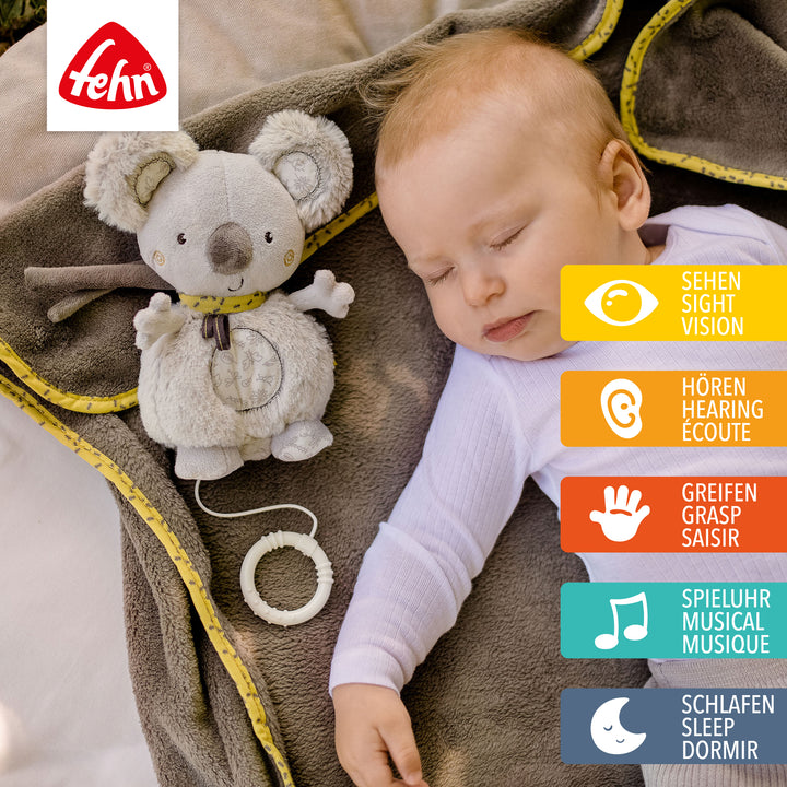 Baby schläft mit Baby Spieluhr Koala