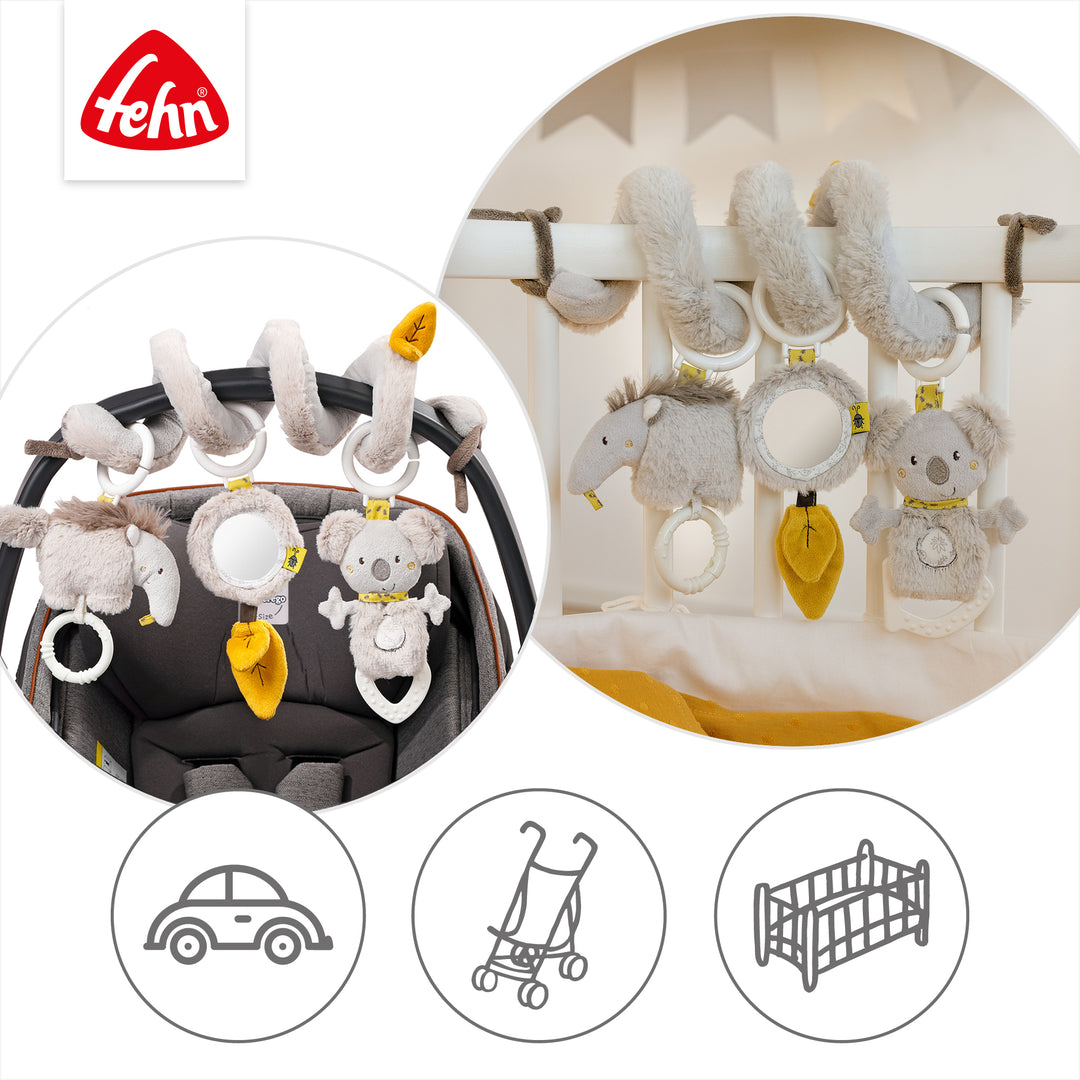 Baby Activity-Spirale Australia an Babybett und Babyschale befestigt