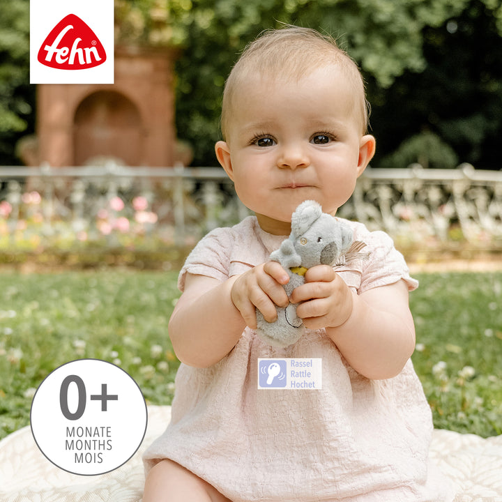 Baby spielt mit Baby Mini-Rassel Koala