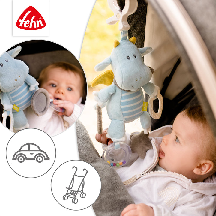 Baby Activity-Drache an Babyschale und Kinderwagen befestigt