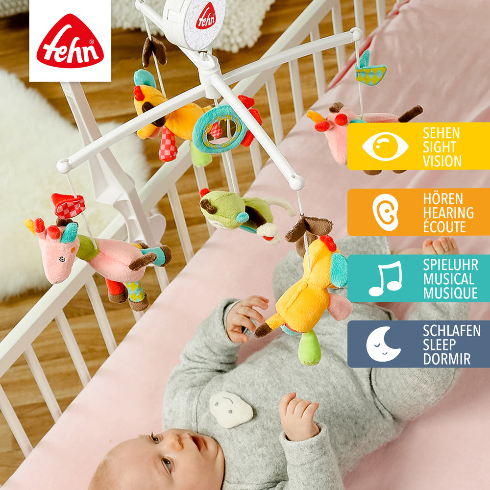 Baby liegt unter Baby Musik-Mobile Safari