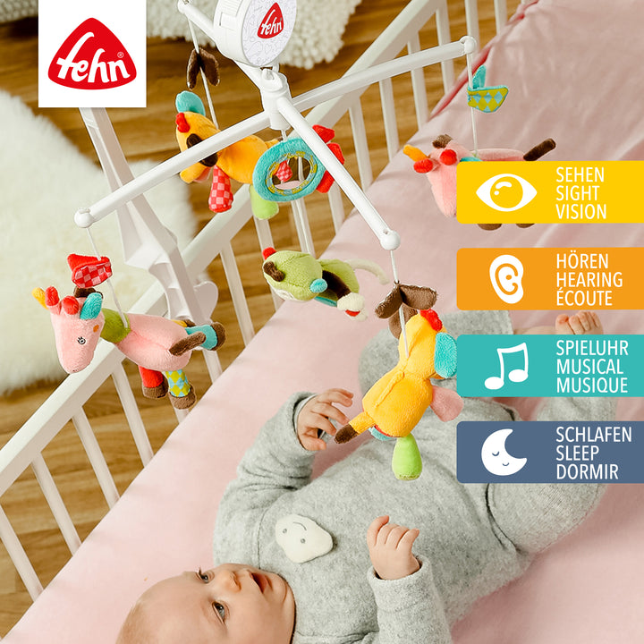 Baby liegt unter Baby Musik-Mobile Safari