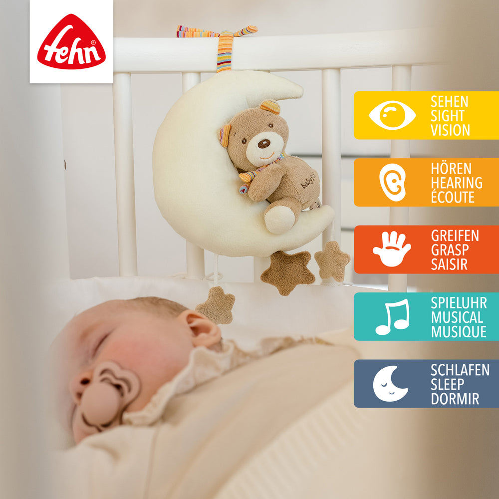 Baby Spieluhr Teddy im Mond am Babybett befestigt