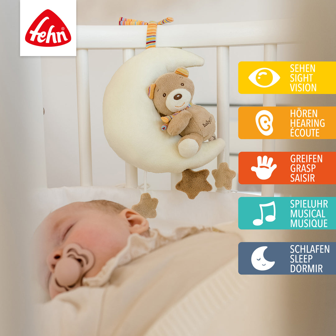 Baby Spieluhr Teddy im Mond am Babybett befestigt